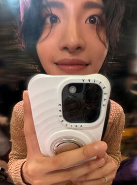 park seonghwa from south korean boyband ateez, being silly whike taking a photo in front of a mirror